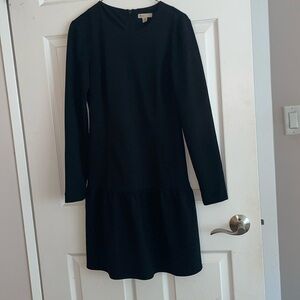 Black long sleeve dress perfect for the office or dinner with puffed bottom